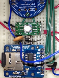 The MS5803 pressure sensor is the little white circle on the green circuit board, just below the writing "SOIC 8PINS".