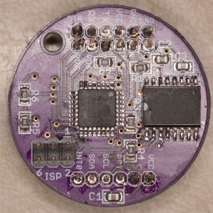 The top side of the CPU disc. The AVR 328P is near center, and the DS3231 real time clock is on the right. 