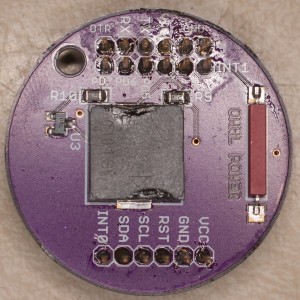 Top side of the power disc, which just holds the magnetic reed switch, piezo buzzer, and associated resistors + transistor. 