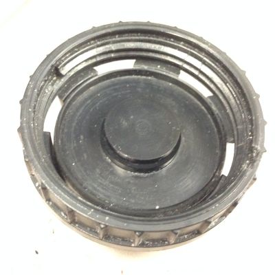 The piston sitting inside the valve body cap, with the small spring hidden beneath it.