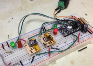 The hall effect sensor board passes (green light) while the unused accelerometer tester fails (red light).