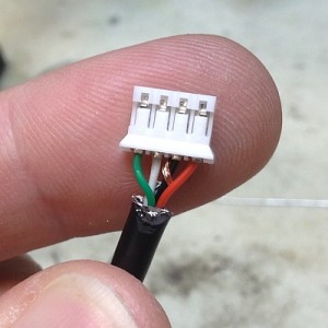 All four pins inserted fully into the connector housing. 