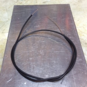 A 36-gauge thermocouple lead jacketed with 1/32" heat shrink tubing. 