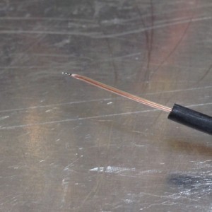 The soldered tip of the thermocouple. 